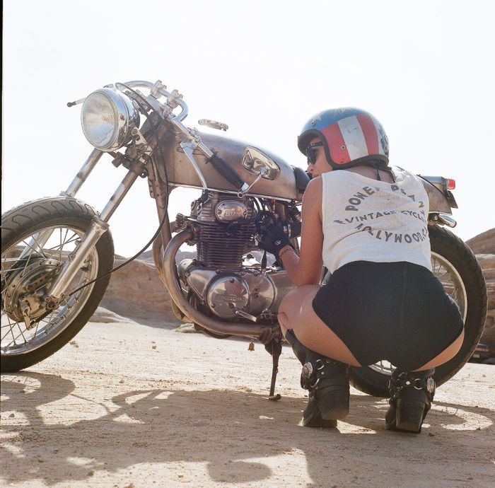 A playful frame from Girls on a motorcycle — online in Hong Kong